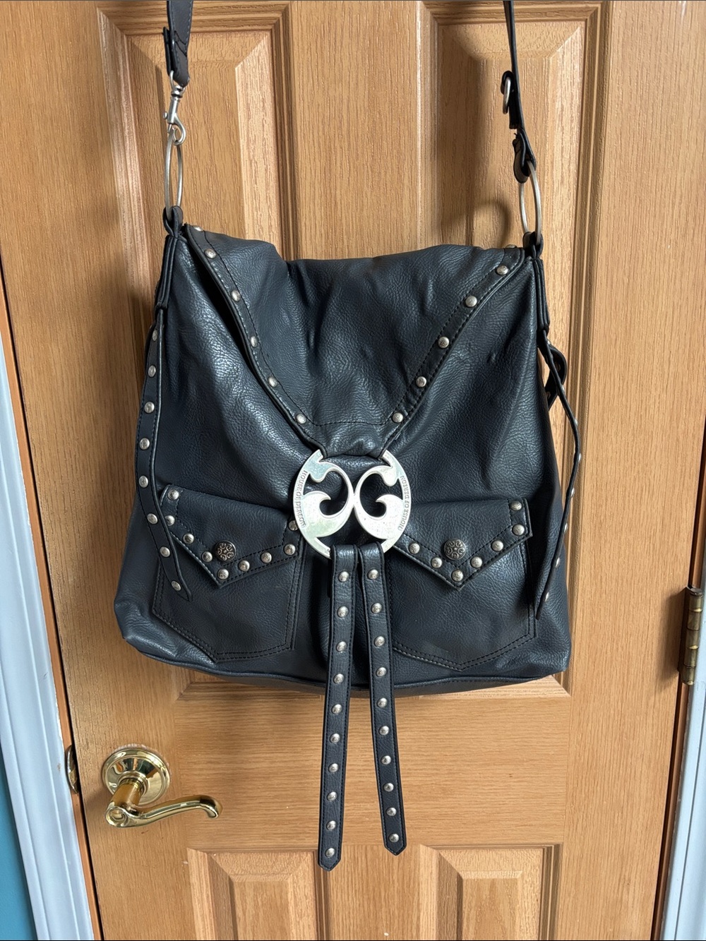 Dereon Black Studded Leather Shoulder Bag with Silver Emblem